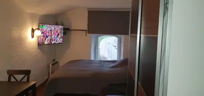 a small room with a bed and a window at senamiescio deimantas in Vilnius