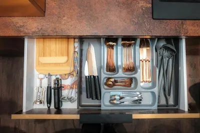a kitchen utensil drawer with utensils in it at UNESCO Hidden Arches – Restored 3 Bedroom Apartment in the Historic Pilies St. in Vilnius