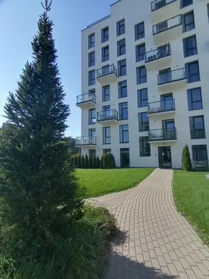 a christmas tree in front of a building at Elzbietos centro apartamentai in Vilnius