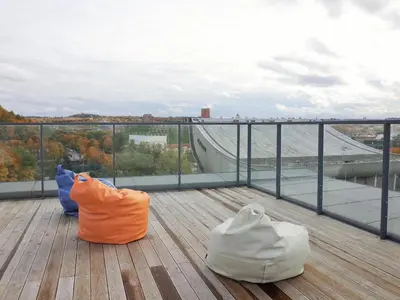 two bags sitting on top of a viewing deck at Elzbietos centro apartamentai in Vilnius