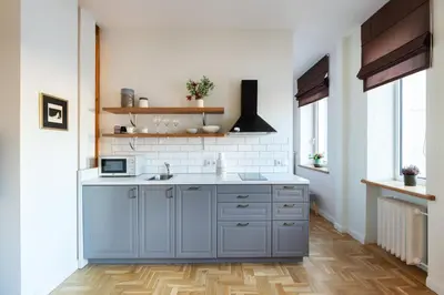 a kitchen with blue cabinets and a sink at Art & Comfort Home in Kaunas