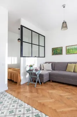 a living room with a couch and a table at Art & Comfort Home in Kaunas