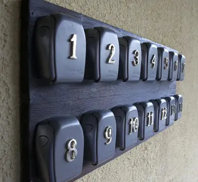 a bunch of black numbers on a wall at DP Art Residence - self check in in Kaunas