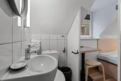 a bathroom with a sink and a toilet at Stay Express in Vilnius