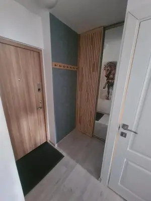 an empty room with a door and a closet at Blue apartment in Šiauliai