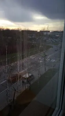 a view of a parking lot from a window at Bright apartment on top in Panevėžys