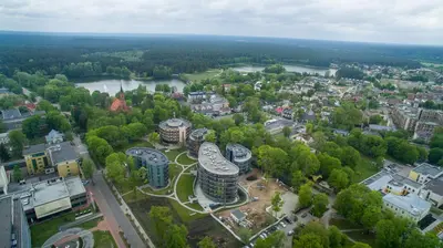 an aerial view of a city with buildings and a river at Mint Studio in Druskininkai
