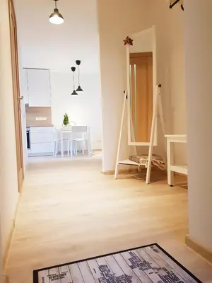 a living room with a hard wood floor at New CITY CENTER apartments in Druskininkai