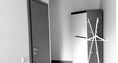 a black and white photo of a refrigerator in a room at Kalniečiai park apartment in Kaunas