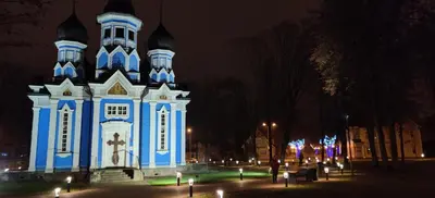 a blue and white building with a cross on it at Jaukus butukas in Druskininkai