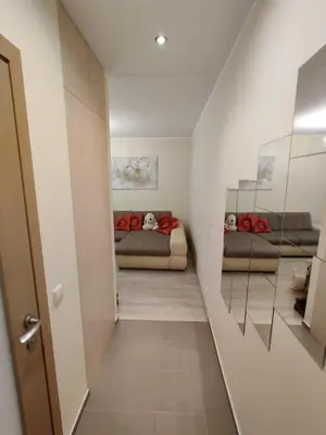 a hallway with two beds in a room at Jaukus butukas in Druskininkai