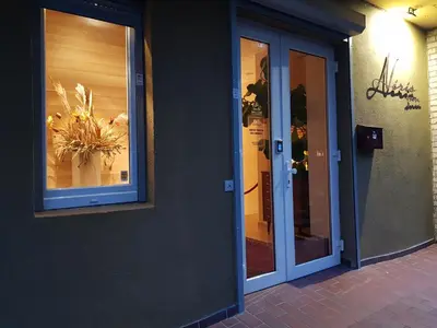 a building with a window with a flower arrangement in it at Nėris Inn Terraces in Vilnius