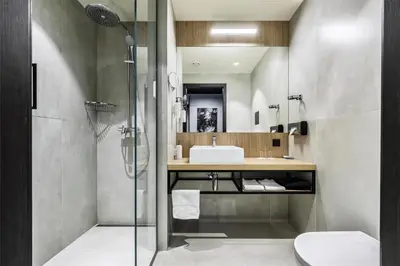 a bathroom with a shower and a sink at Park Inn by Radisson Vilnius Airport Hotel & Conference Centre in Vilnius