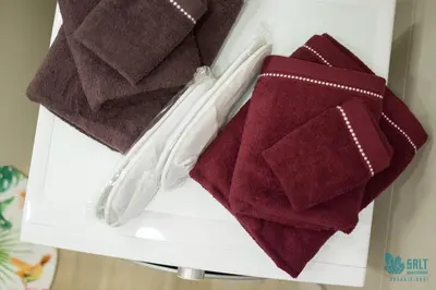 a drawer filled with towels on a shelf at Salt Apartments in Druskininkai