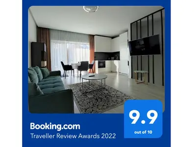 a living room with a couch and a table at NEW J&R Apartment near Girstutis, Free private parking & Self Check-In in Kaunas