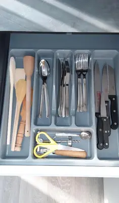 a tray filled with utensils in a drawer at NEW J&R Apartment near Girstutis, Free private parking & Self Check-In in Kaunas