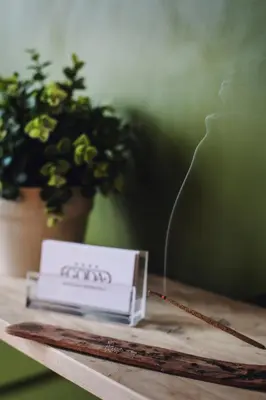 a table with a box on a table with a plant at Goda Hotel & Spa in Druskininkai