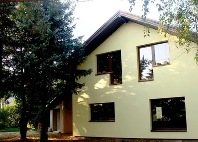 a house with windows on the side of it at Studio by the Lake Kaunas in Kaunas