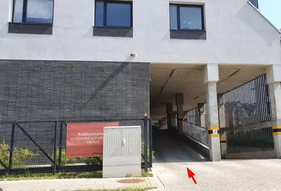 a building with a sign on the side of it at Bitenu Studio in Vilnius
