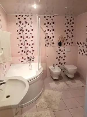 a bathroom with a tub and a toilet and a sink at Irene apartments in Druskininkai