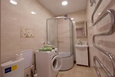 a bathroom with a shower and a toilet and a sink at Lukšio Apartment in Šiauliai