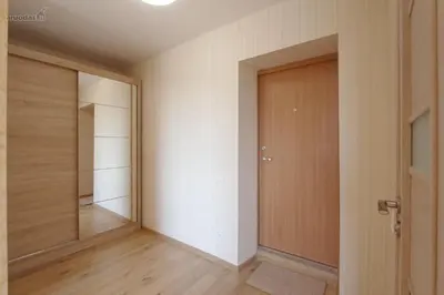 an empty hallway with a door and a mirror at Lukšio Apartment in Šiauliai