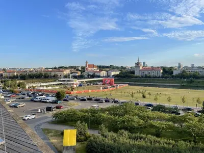 a parking lot with cars parked in a parking lot at Your Home - Stylish Studio Apartment in Center, with Balcony & Self Check-in in Vilnius