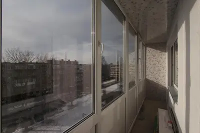 an empty room with a window with a view of a city at Sondeckio Apartment in Šiauliai