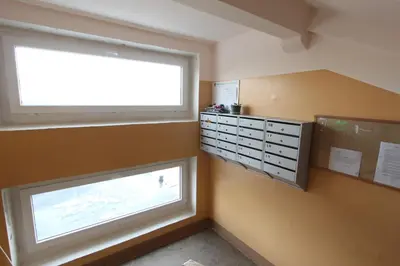 a room with a window and a dresser and a window at Sondeckio Apartment in Šiauliai