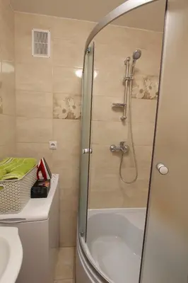 a bathroom with a shower and a sink at Sondeckio Apartment in Šiauliai