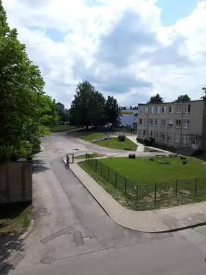 an empty street with a skate park next to a building at Alytus Ziburio studio in Alytus