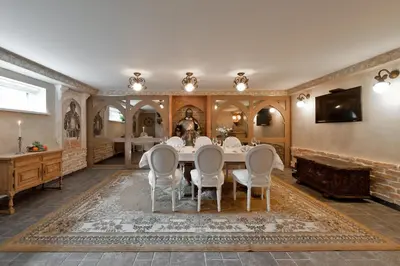 a dining room with a table and chairs at Viva Trakai in Trakai