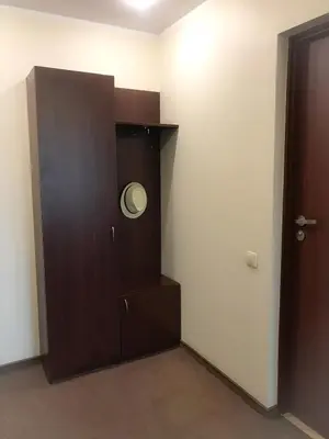 a room with a brown cabinet with a door at Alanta 