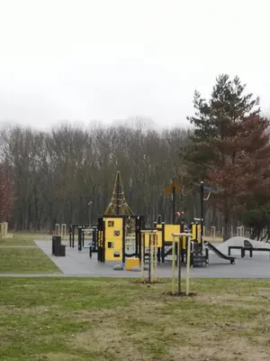 a park with a bunch of playground equipment at Parko apartamentai in Panevėžys