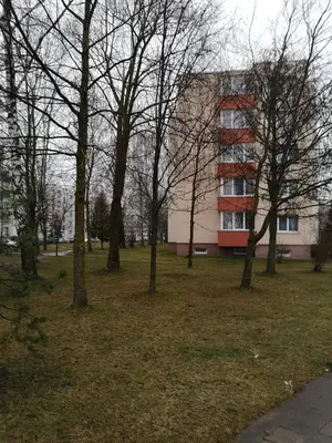 a group of trees in front of a building at Parko apartamentai in Panevėžys