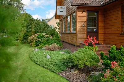 a house with a garden in front of it at Zofija in Birštonas