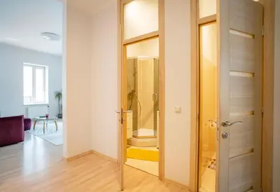 a room with a closet with a glass door at Kaunas Castle Apartments - One bedroom flat in Kaunas