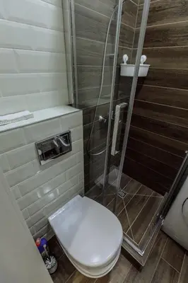 a bathroom with a toilet and a shower at Švitrigailos 7 in Vilnius