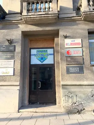 a door to a building with graffiti on it at Švitrigailos 7 in Vilnius