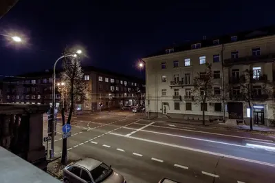 an empty city street at night with a street light at Švitrigailos 7 in Vilnius