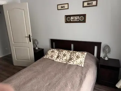 a bedroom with a bed with a pillow on it at Brand new flat heart of Vilnius in Vilnius