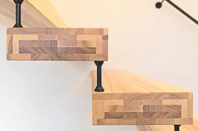 a close up of a wooden table with a lamp at Kaunas City Center loft by URBAN RENT in Kaunas