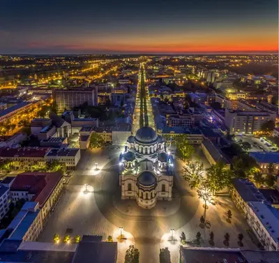 an aerial view of a city at night at Green Hill Apartments in Kaunas