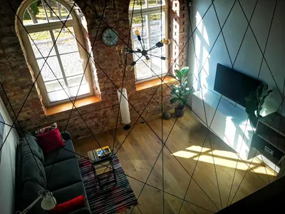 an overhead view of a living room with two windows at Botanical Garden Studio in Kaunas
