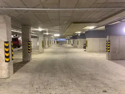 an empty parking garage with a long hallway at Near Ozas Studio in Vilnius