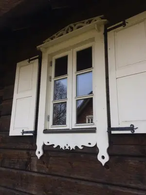 a window on the side of a house at Baublys Lake Lodge in Viktarinas