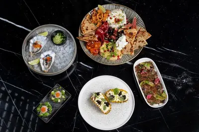 a group of plates of food on a table at Ego SPA - Adults Only in Birštonas