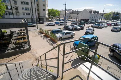 a parking lot with cars parked in a parking lot at House 22A Studio Apartments in Kaunas