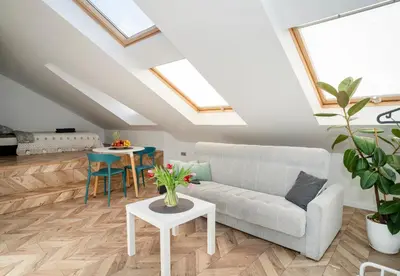 a living room with a couch and a table at House 22A Apartments in Kaunas