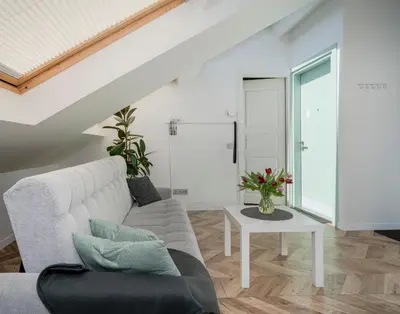 a living room with a couch and a table at House 22A Apartments in Kaunas